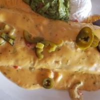 Burrito Grande · Our largest burrito filled with beans, beef or chicken. Topped with our red gravy and jalape...