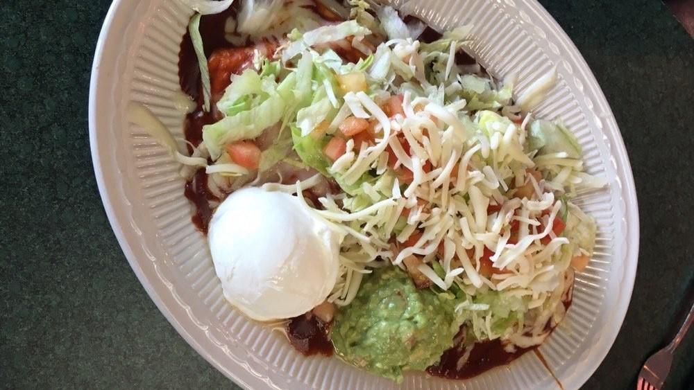 Burrito Supreme · One burrito with chicken, beef, or beans. Topped with our traditional red gravy, lettuce, tomatoes, and shredded cheese. Served with a side of sour cream and guacamole.