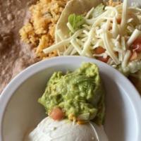 Spicy Fish Tacos · Two soft or crispy tacos filled with grilled tilapia and pico de gallo. Served with a side o...