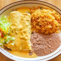 Golden Enchilada Dinner · Two enchiladas with chicken, beef, or cheese. Topped with our house queso sauce. Served with...