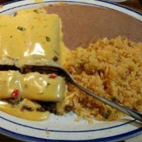 Texas Enchilada Dinner · Two enchiladas with chicken, beef, or cheese. Topped with our Texas sour cream sauce. Served...