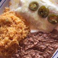 House Enchilada Dinner · Two enchiladas with chicken, beef, or cheese. Topped with our traditional red gravy. Served ...