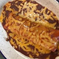 Entomatada Dinner · Two enchiladas with chicken, beef, or cheese. Topped with Swiss cheese, sour cream, and our ...