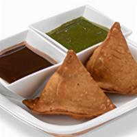 Samosa. · A fried pastry filled with spice potato-peas mixtures. Served with chutneys.