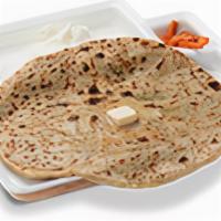 Paneer Paratha · Unleavened dough stuffed with a spiced micture of gratted paneer, rolled out and cooked on a...