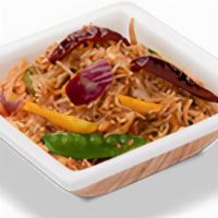 Schezwan Fried Rice · Basmati rice tossed with spicy Szechuan sauce, cabbage, carrots, bell peppers, mushroom and ...