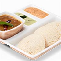 Idly Sambhar. · Steamed rice and lentil white cakes, served with aromatic sambhar.