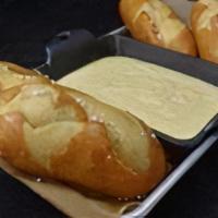 Bavarian Pretzels · Served with Gouda cheese sauce