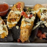 Coyote Rolls · Tinga chicken, cojia and cheddar cheese, black bean, corn, roasted red pepper, charred jalap...