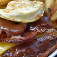Hazy Sunrize · Short ribs, BBQ, fried egg, cheddar cheese, bacon

Served on a butter grilled bun with truff...