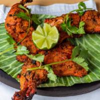 Chicken 65 · Chicken cooked with Indian spices, pan grilled.