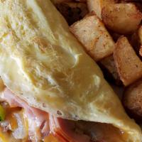 Meat Lovers' Omelet · Jack and cheddar, bacon, ham, and sausage.