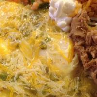 Huevos Rancheros · Served on a corn tostada, cheese, green salsa. Served with rice, refried beans, sour cream a...