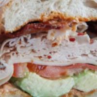 Turkey And Bacon Sandwich · Cheese, mayo, mustard, lettuce, tomato, and pickle