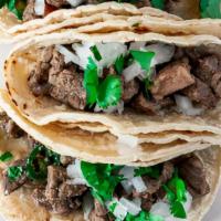 Three Steak Tacos · Rice, beans, pico de gallo, and salsa