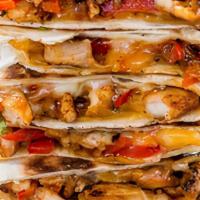 Mexican Chicken Quesadilla · Rice and beans, sour cream, jack and cheddar, pico de gallo