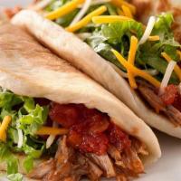 Three Shredded Beef Tacos · Served with lettuce, pico de gallo, rice and beans, salsa
