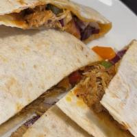 Baja Chicken Quesadilla · Spiced chicken, cheddar-jack cheese, house salsa and sour cream
