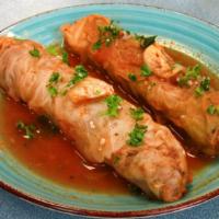 Meat Cabbage Roll · (2) hand-rolled cabbage leaves stuffed with rice, ground beef and spices cooked in tomato sa...