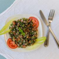 Tabbouleh Salad · Fresh chopped parsley, tomatoes and onions, with cracked wheat, freshly squeezed lemon and e...