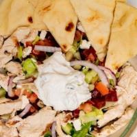 Chicken Gyro Greek Salad · Classic Greek salad with feta, chickpeas and shredded beets, topped with chicken gyro and tz...