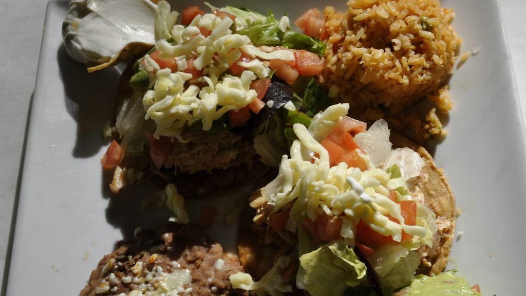 Combinacio Taxco · One beef crispy taco, one cheese enchilada with mole sauce & one beef tostada or pork tamale.