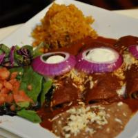 Enchiladas (Traditional) · Choose ranchera, chipotle, tomatillo. filled with chicken, grated cheese and onions.