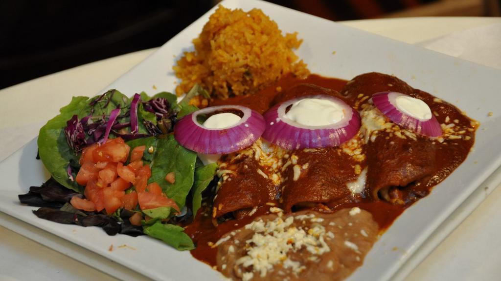 Enchiladas (Traditional) · Choose ranchera, chipotle, tomatillo. filled with chicken, grated cheese and onions.