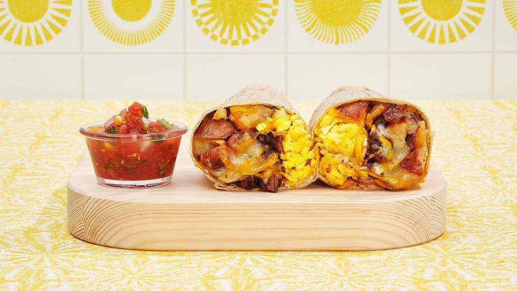 Brisket Breakfast Burrito · Two scrambled eggs, brisket, hash browns, and melted cheese wrapped in a fresh flour tortilla.