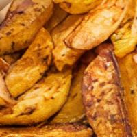 Potato Wedges · Large chunk of potato that are fried. add cheese for an additional charge.