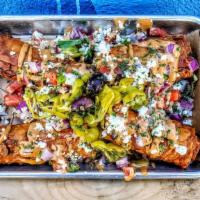 Full Order Of Doquitos (2) · Think Mediterrnean taquito, but better, lavash bread rolled with zesty feta, onion, aioli, f...