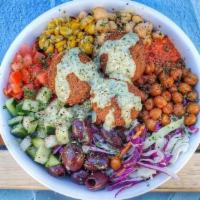 Vegan Remix Bowl · Falafel, dill-tahini quinoa, tomato, cucumber, roasted corn, harissa, kalamata olives, crisp...
