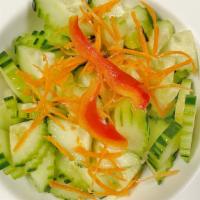 Cucumber Salad · Cucumbers and carrots with sweet and sour dressing.