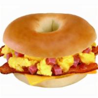 Ultimate Bagel · Scrambled Eggs and ham mixed together, bacon, American & Swiss cheese served on a butter toa...