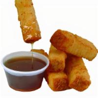 French Toast Sticks (5) · Hot & fresh, golden brown French toast sticks served with maple syrup