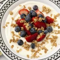 Yogurt Parfait (V) · Greek Vanilla Yogurt topped with Berries Granola & Honey