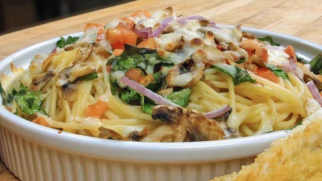 Spinach & Garlic Spaghetti · Spinach, mushrooms, red onion, and tomato. Served with our creamy garlic sauce and topped with mozzarella.