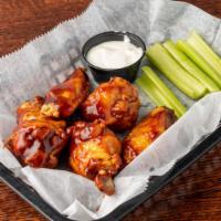 Tavern Wings · Choice of Buffalo, sweet BBQ, or Cajun dry rub. Served with celery and Blue cheese or ranch.