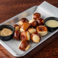 Pretzel Bites · Served with cheddar cheese sauce and ground mustard.