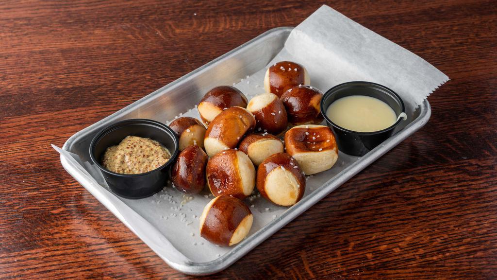 Pretzel Bites · Served with cheddar cheese sauce and ground mustard.