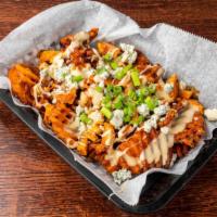 Buffalo Chicken Sweet Potato Fries · Sweet potato waffle fries topped with white cheese sauce, crumbled blue cheese, green onion,...