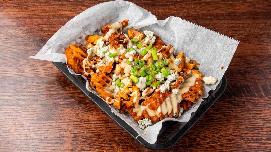 Buffalo Chicken Sweet Potato Fries · Sweet potato waffle fries topped with white cheese sauce, crumbled blue cheese, green onion, and grilled buffalo chicken.