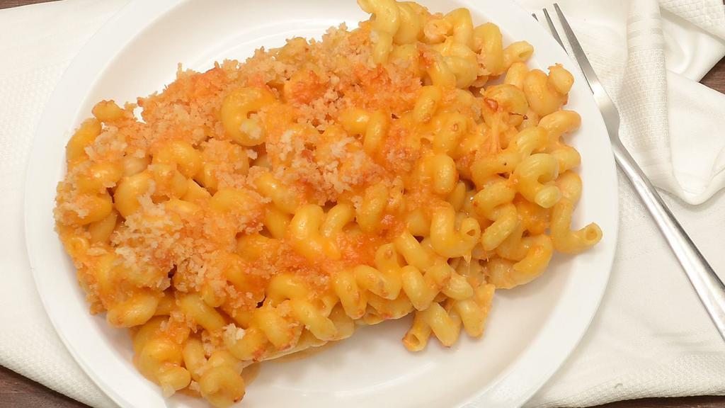 Build Your Own Mac-N-Cheese · Generous portion of cavatappi noodles, house made cheese sauce, shredded cheddar cheese and bread crumbs baked in the oven.