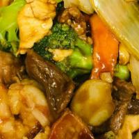 Four Seasons 炒四季 · A combination of pork, chicken, beef, and shrimp stir fried with mixed vegetables in a brown...