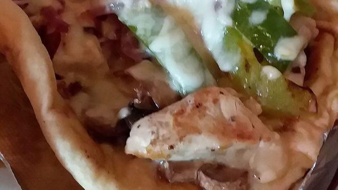 Chicken Philly Gyro · Marinated chicken with sauteed green peppers, onions, mushrooms, mozzarella, and provolone cheese.