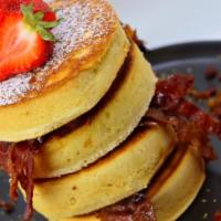 Super Scriddle Pancakes · 4 jumbo pancakes stuffed w/ scrambled eggs, candied bacon, & our house-made sausage drizzled...