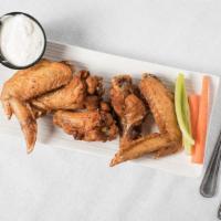 Wings · Naked wings tossed in any of our signature sauces of your choice, served with celery and car...