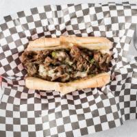 Chgo Style Philly Cheese Steak · Steak or chicken marinated in onion and bell pepper special survey Provolone Gouda Mozzarell...