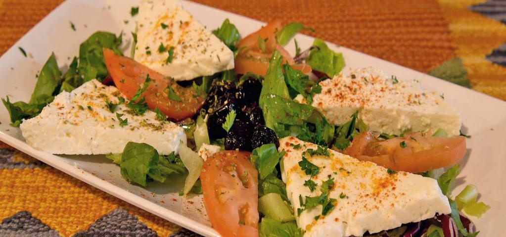 Feta Cheese Plate · Imported feta cheese served with tomatoes, cucumbers, black olives and parsley.