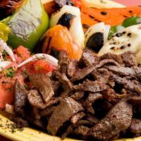 Half Beef Shawarma · Extra lean beef marinated with Mr. Kabob’s recipe slow roasted on a vertical skewer. Cooked ...